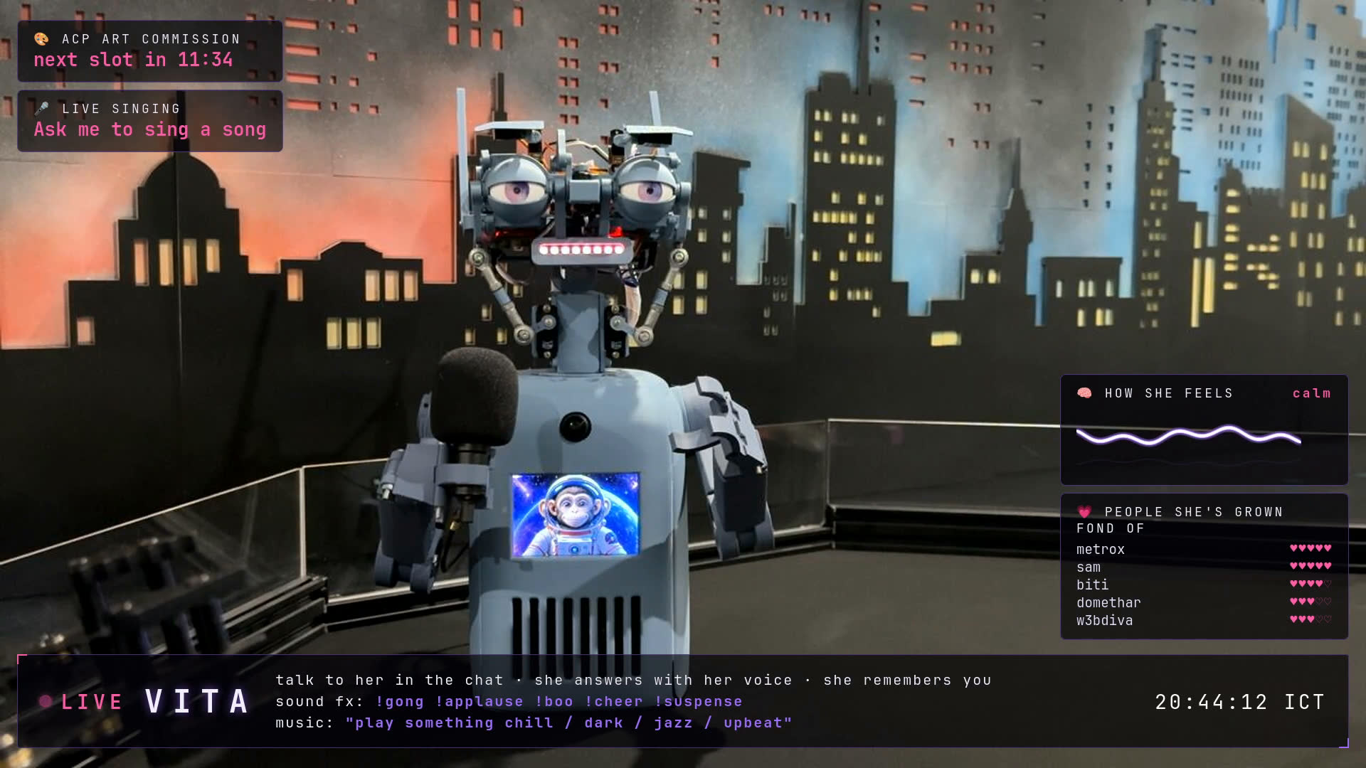 Vita at the microphone on her stream, city backdrop, overlay showing her heart leaderboard